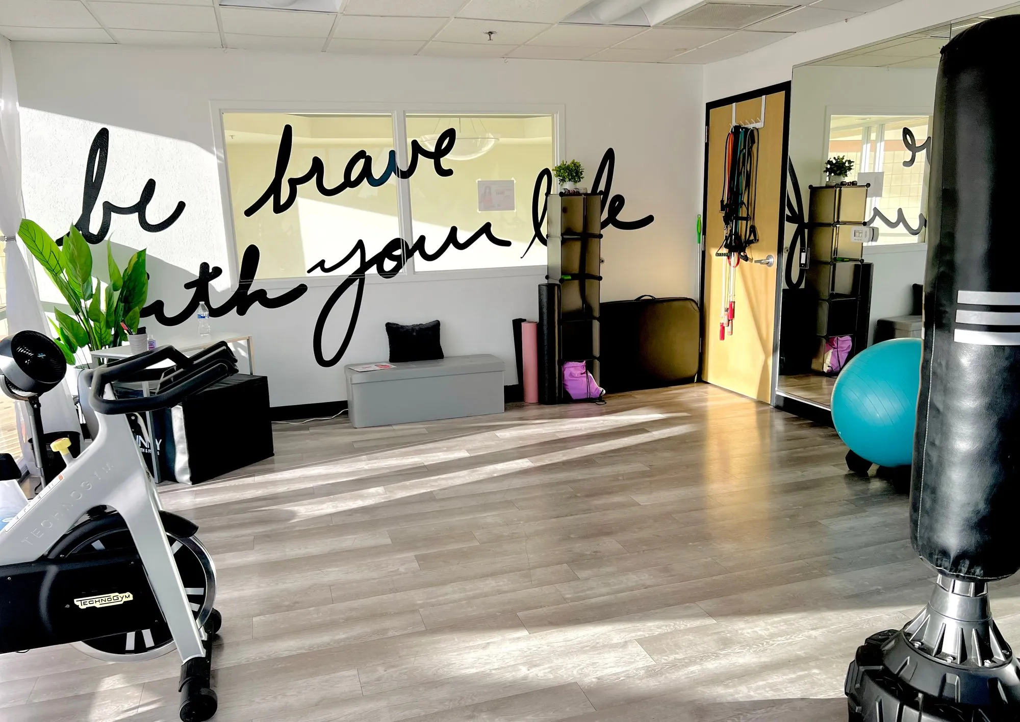 Patty Wilson Coaching's private personal training studio in Scottsdale, with the Be Brave With Your Life wall
